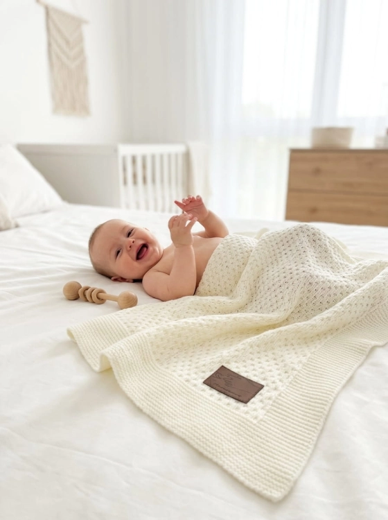 Baby_laughing_on_bed_202606111722.jpeg