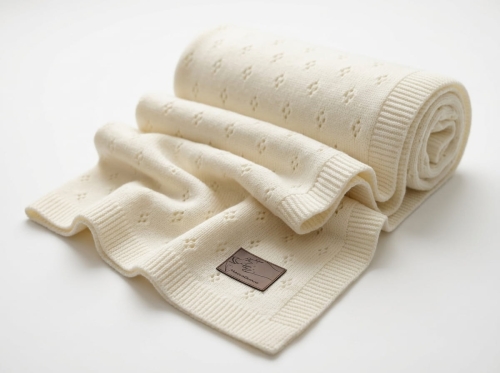Knitted_blanket_with_leather_tag_202606111855.jpeg
