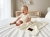 Baby_laughing_on_bed_202606111900.jpeg