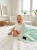 Baby_laughing_on_bed_202606111915 (2).jpeg